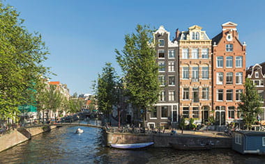 A canal on a sunny day in Amsterdam A canal on a sunny day in Amsterdam
